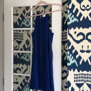 Navy silk dress with gold chain straps and keyhole